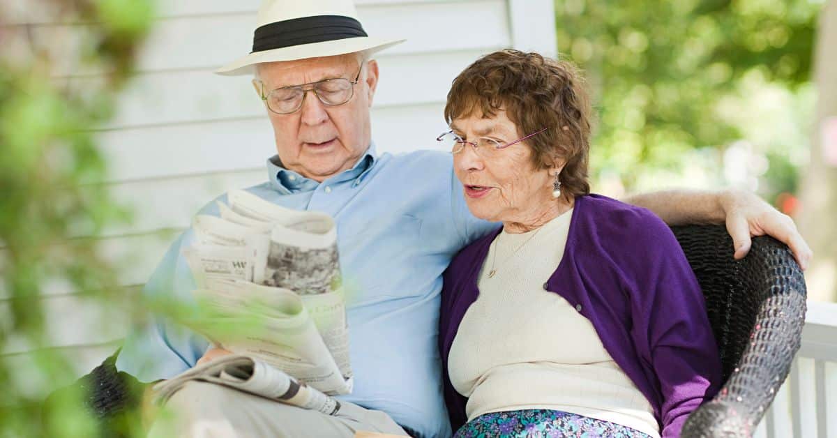 Seniors Reading In Senior Assisted Living Facility
