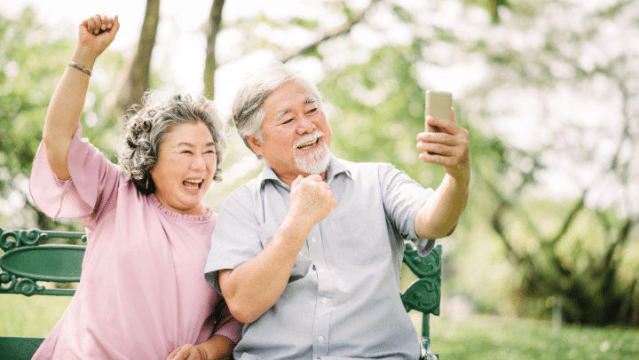 Exploring The Genetic Link In West Union, Ia: How Family History Influences Dementia Risk 3 An Elderly Couple Making A Video Call From Their Cell Phone